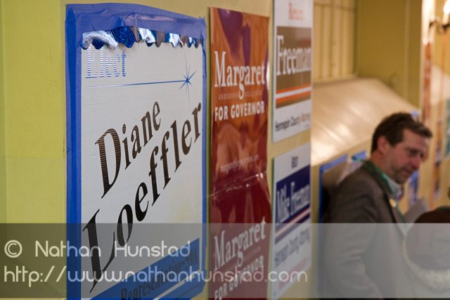 Campaign signs on the walls at the SD59 convention